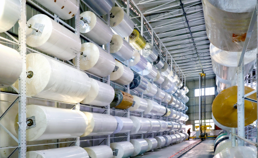 Warehouse storing jumbo rolls of self-adhesive label material